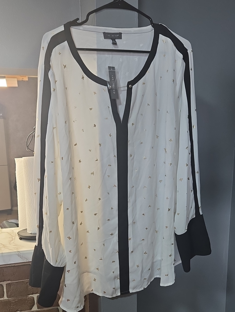The Limited White Blouse with Black Trim and Gold Accents